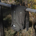 Photo of the Laramie shirt folded over a fence in Montana