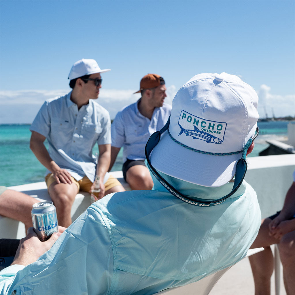 White mens hat, group of men on boat