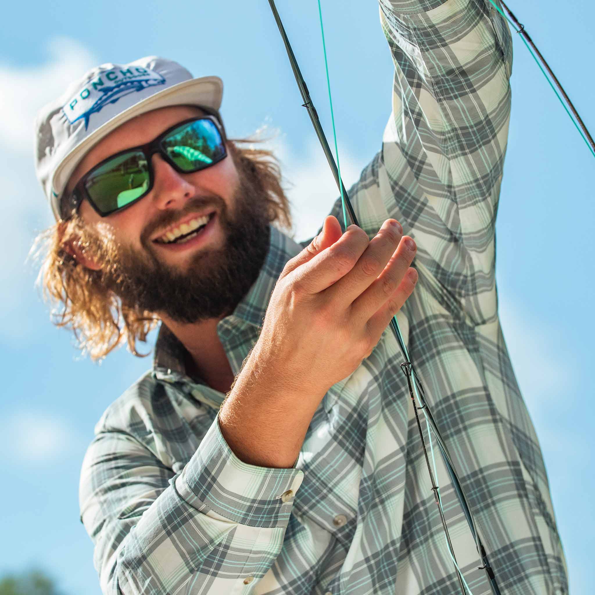 close up of guy holding fishing rod