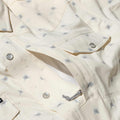 Closeup of floral shirt front pockets.