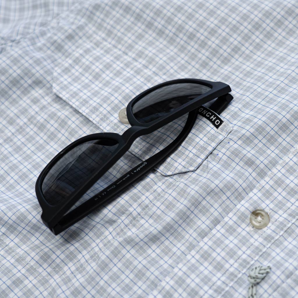 Blue & grey plaid short sleeve fishing shirt  sunglass close up