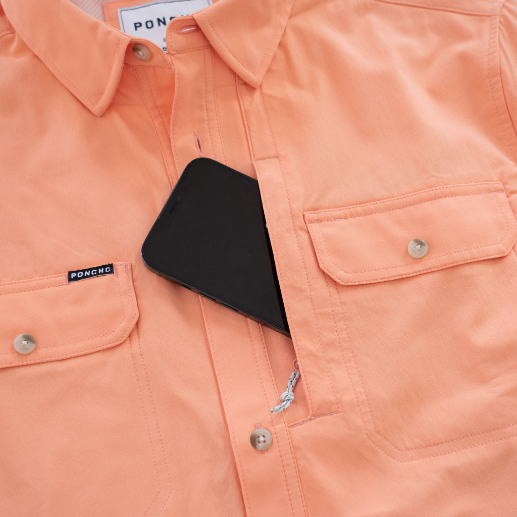 light orange long sleeve fishing shirt cell pocket closeup