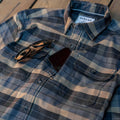 closeup of chest plaid flannel shirt